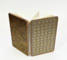 Notebook with open pages and cover detail.