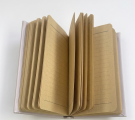 Notebook with open pages, ruled line, tinted paper.